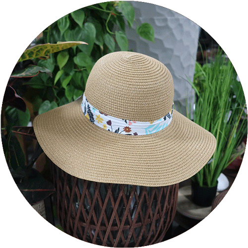 A sun hat with a floral ribbon around it.